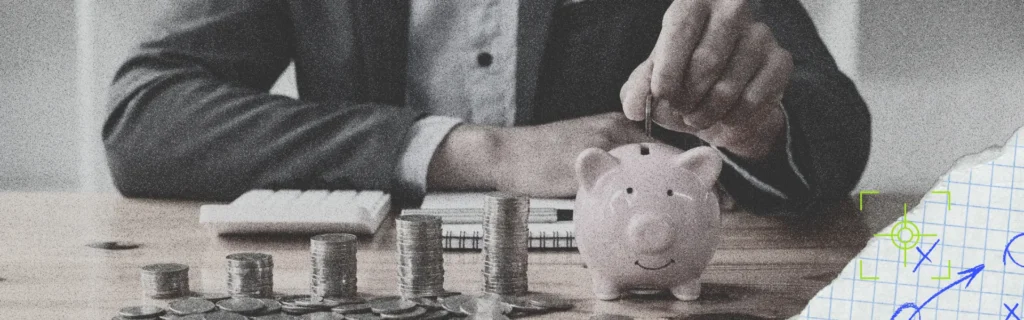 man putting coin into piggy bank