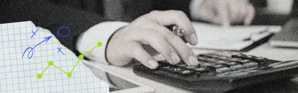Person at desk using a calculator to work out weekly super amounts for new payday super.